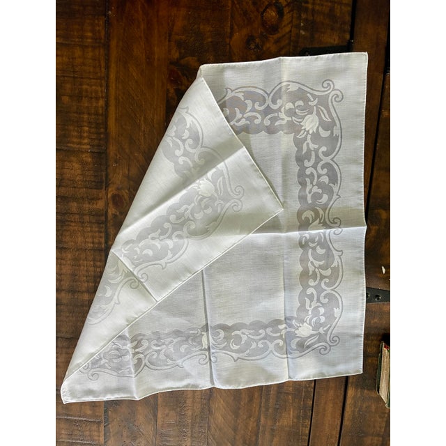 vintage organza napkin featuring a tulip and flourish burnout cutwork print design, perfect to be used for formal...