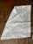 vintage organza napkin featuring a tulip and flourish burnout cutwork print design, perfect to be used for formal...