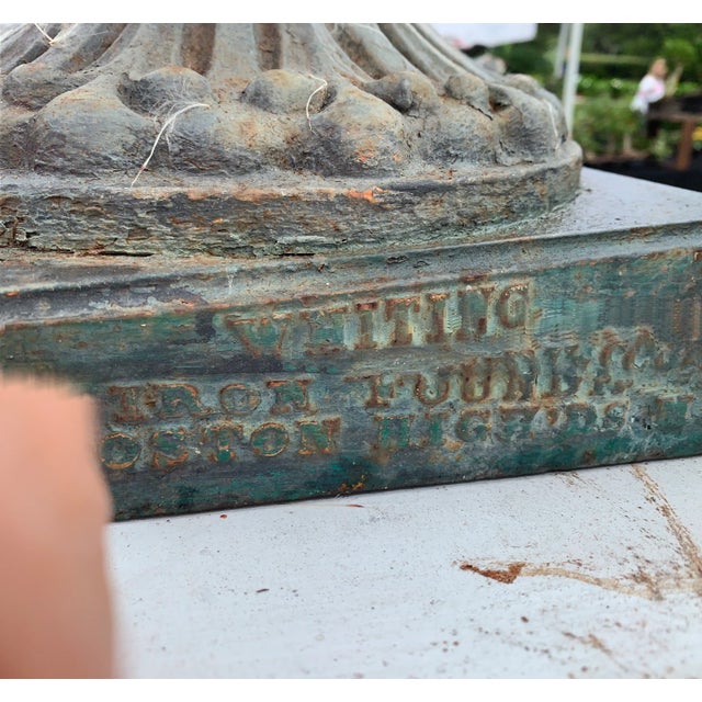 A cast iron garden urn signed by Boston maker in business in the 1890s. The name which is marked on the base is the...