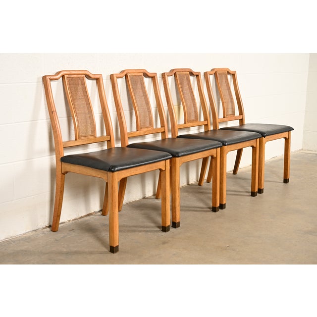 A gorgeous set of four Mid-Century Modern Hollywood Regency Chinoiserie dining chairs In the manner of Henredon USA, Circa...