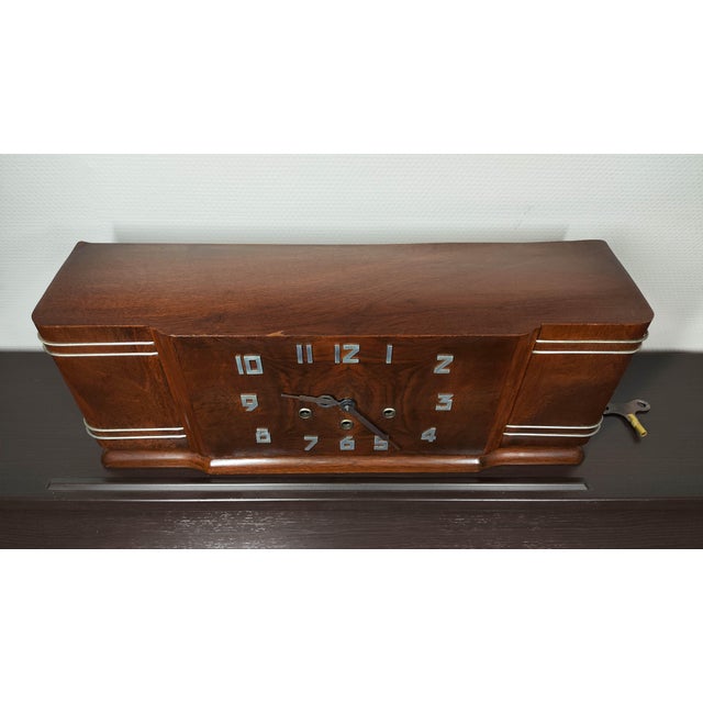 A Masterpiece of French Horology from the Jura Mountains. Presenting an authentic mid-century mantle clock by the...