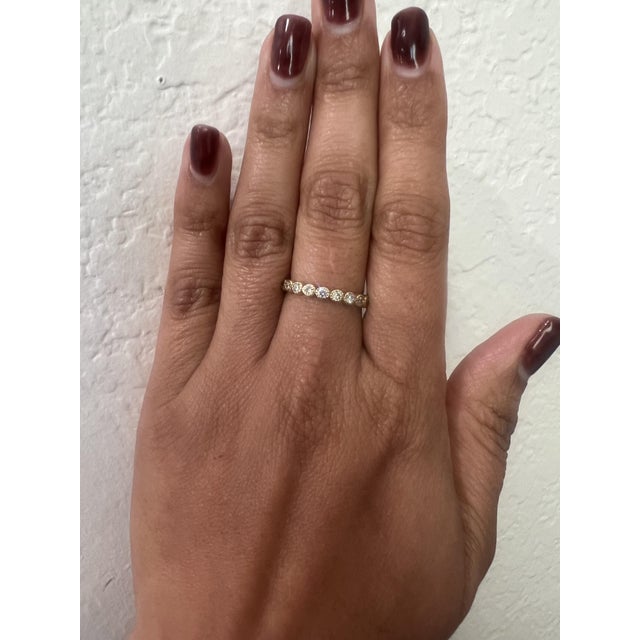 This band has Natural Round Cut Diamonds that weigh 0.44 carats and has a clarity and color of VS-H. The band is...