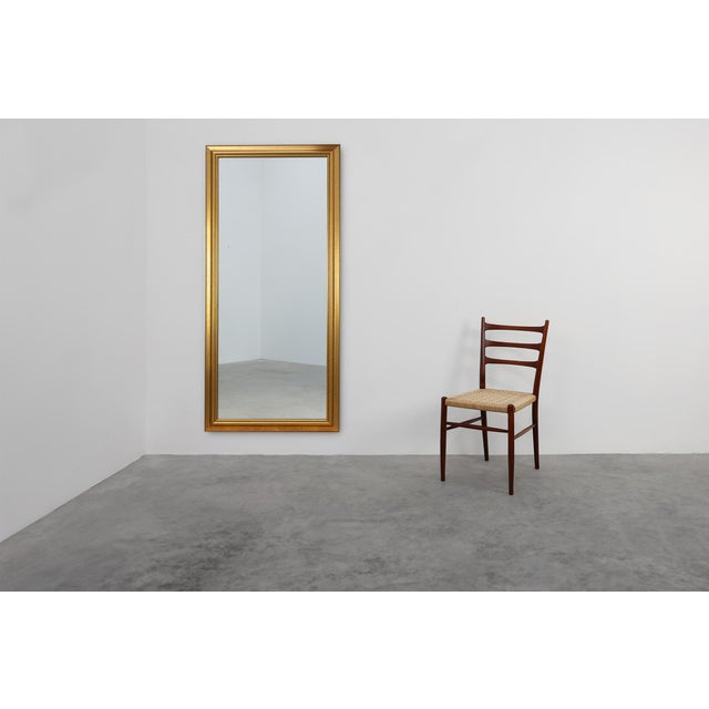 Dating back to the mid-20th century, this substantial classic mirror by the esteemed Belgian manufacturer Deknudt exudes...