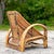 An incredible 1950s Coastal lounge chair. A chic pencil reed with a bent rattan frame. Coordinating loveseat also...