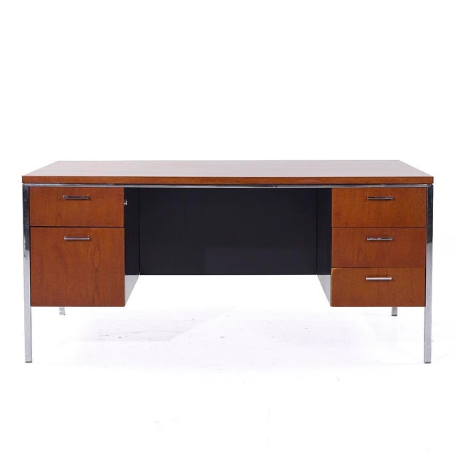 Mid Century Walnut and Chrome Executive Desk This desk measures: 65 wide x 36 deep x 30 high, with a chair clearance of...