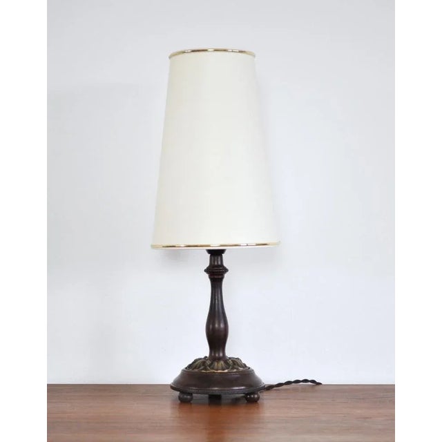 Art Nouveau table lamp in wood and brass. Early 20th century, probably Danish. Fine vintage condition with a beautiful...