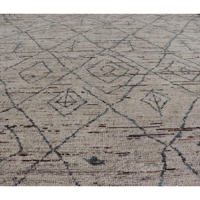 Modern Moroccan Rug by Keivan Woven Arts in Cream and Blue This modern tribal rug has been hand-knotted in wool. The rug...