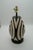 Add a touch of artisan elegance to your home with this stunning handcrafted lamp made from authentic Chulucanas pottery....
