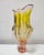 This listing features a large, pink and yellow vase shaped as a flower bud. It was designed by Josef Hospodka, an artist...