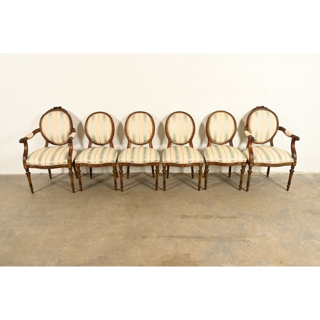 A gorgeous set of six French Regency Louis XVI style dining chairs In the manner of Karges Furniture USA, Circa 1960s...