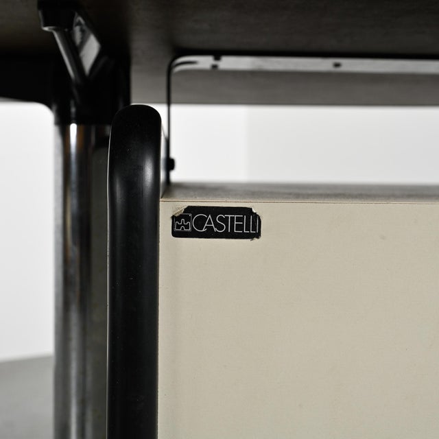 Desk designed by Giancarlo Piretti for Castelli in Italy in the 1970s. This model features a long, rectangular top in...