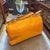 This vibrant Louis Vuitton Brea bag is crafted from striking yellow Monogram Vernis patent leather, featuring an embossed...