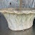 Pair of Vintage Regency Patinated Cement Planters, showcasing elegant, weathered finishes with classic trellis designs....