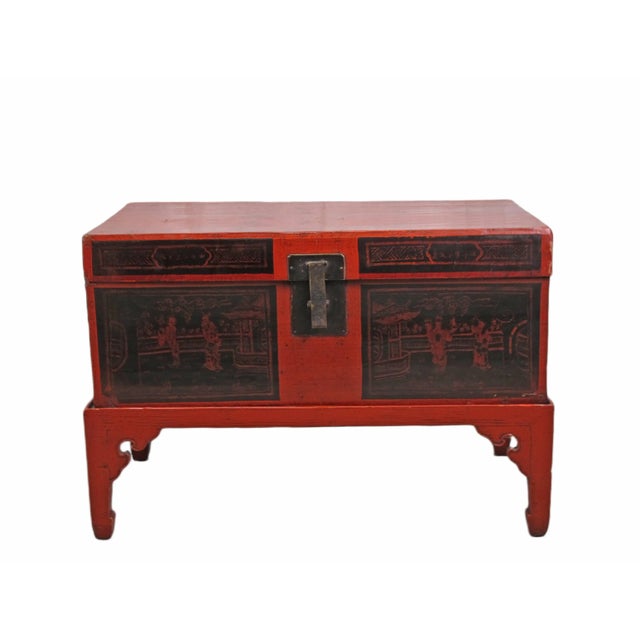 This charming antique Chinese trunk is adorned by hand-painted people in the court yard and nicely aged patina and...