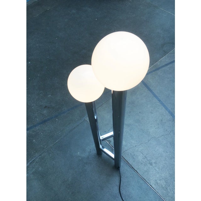 Rare space age floor lamp in chrome and glass. a simple yet imposing form. The lamp consists of chrome-colored cylinders...