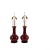 A striking pair of mid-20th-century oxblood sang de boeuf porcelain vase lamps, each crafted from Chinese baluster-form...
