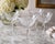 A beautiful set of four vintage Tiffin Franciscan Chardonnay etched crystal champagne coupes, showcasing the beloved...