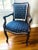 Beautiful English wood armchair upholstered in a vintage blue and white batik ikat fabric throw and highlighted with a...