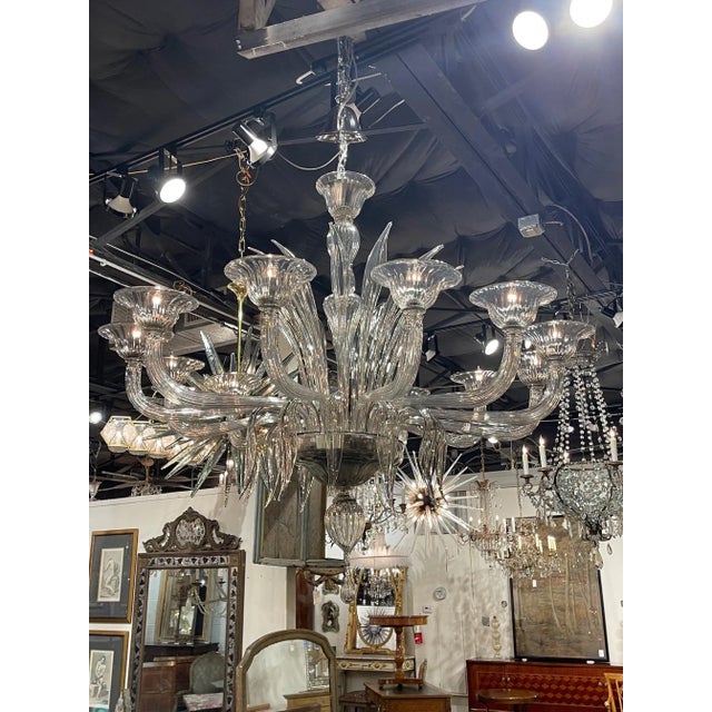 Decorative smoke colored murano glass chandelier with 12 lights. A very special fixture that creates a high end look!