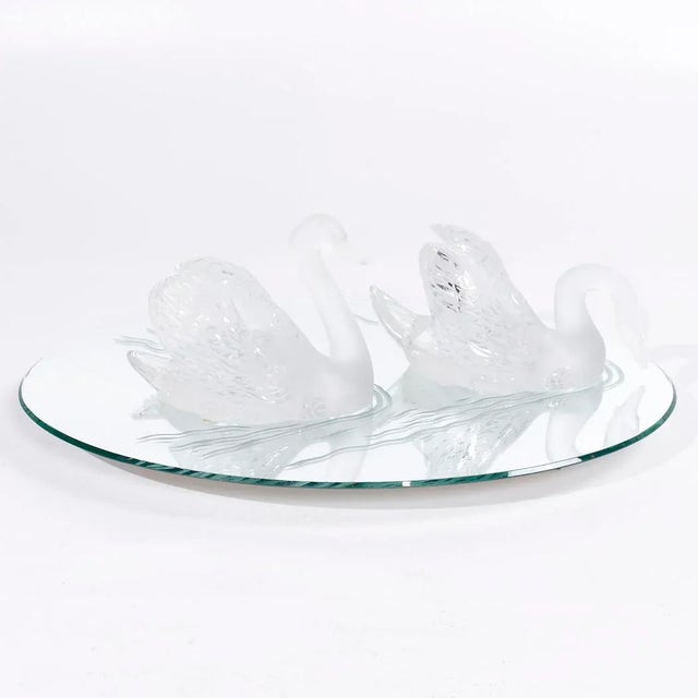 Lalique Frosted Crystal Swimming Swans Pair with Mirror This crystal set measures: 33 wide x 22.25 deep x 10 high ABOUT...