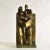 Cubist bronze sculpture of a standing couple with child is framed by a rectangular wall which continues into the base acts...