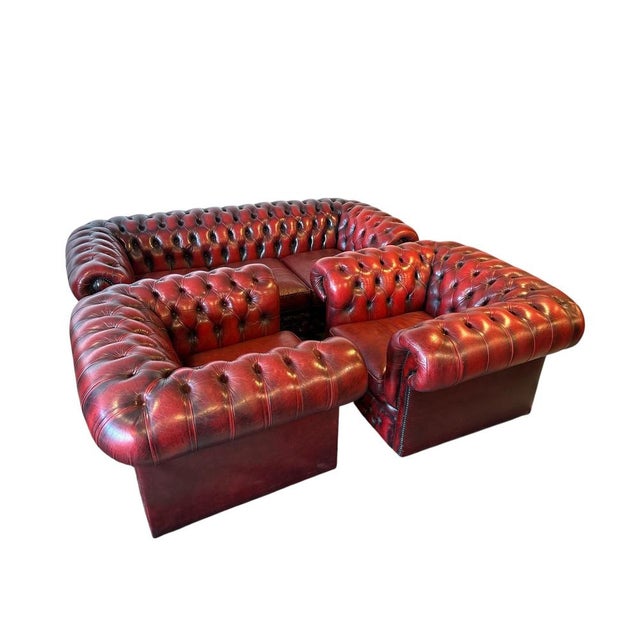 Genuine leather with deep button tufting. Traditional Chesterfield with rolled arms and studded detailing One three-seater...