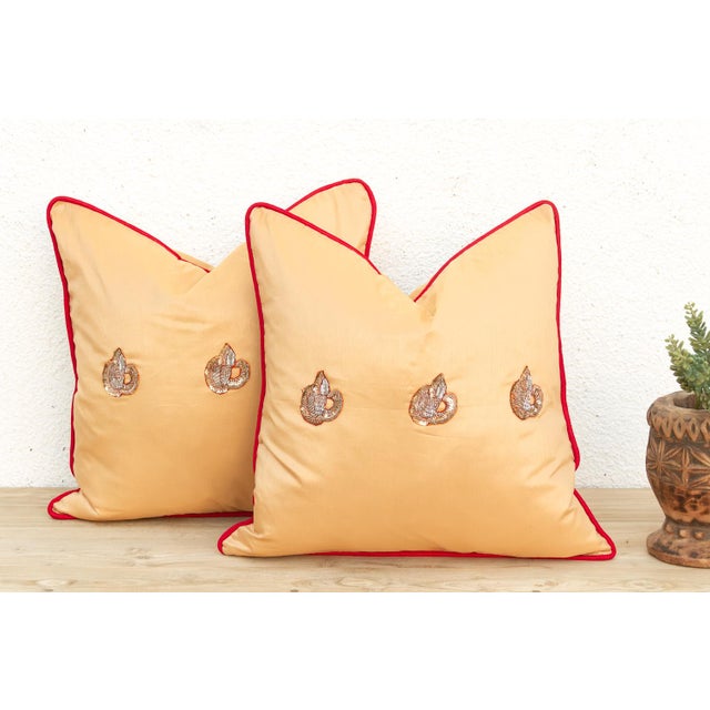 Crafted in India from a lustrous silk-blend textile, this pillow cover is embellished by hand with traditional Zardozi-...