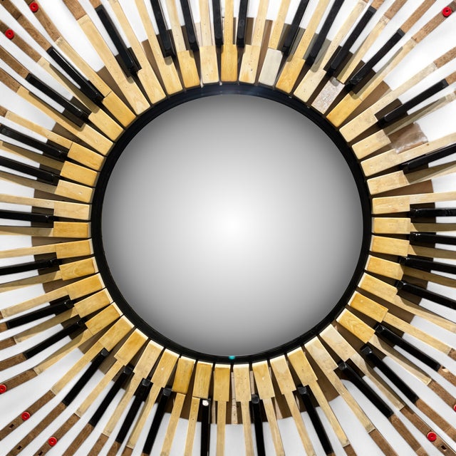 Vintage convex mirror with a handcrafted frame made from piano hammers and keys, designed in the 1980s. The pieces are...