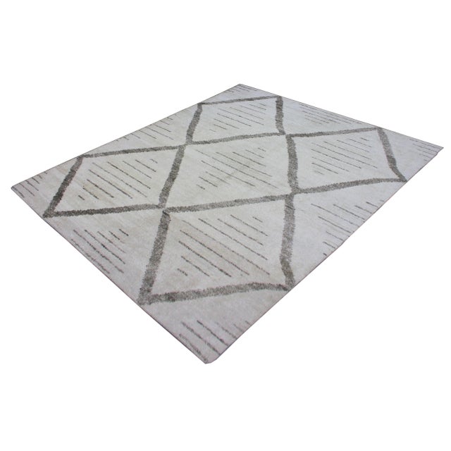A beautiful handmade environmentally friendly Bamboo and silk rug, with a geometric design is made of 75% bamboo silk and...