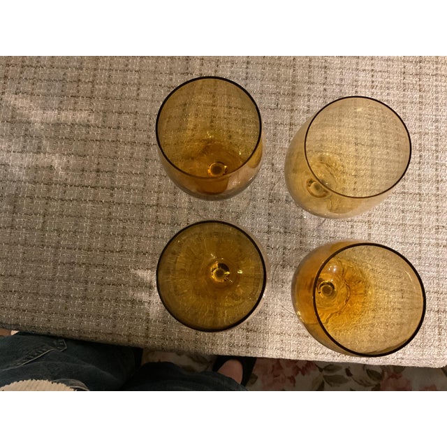 This set of four wine glasses are a beautiful amber color . They are in like new condition