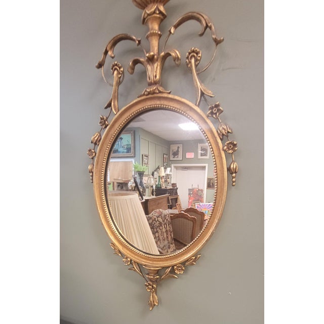 Rare pair of Italian vintage Adams style diminutive wall mirrors. Featuring a rare small size, gilding over wood...