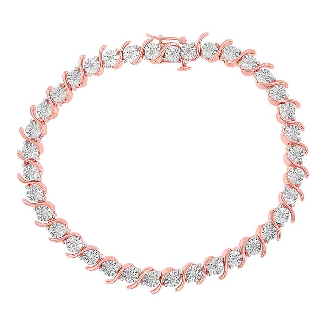 Elegant and timeless, this gorgeous 92.5% sterling silver tennis bracelet features 0.1 carat total weight of natural round...