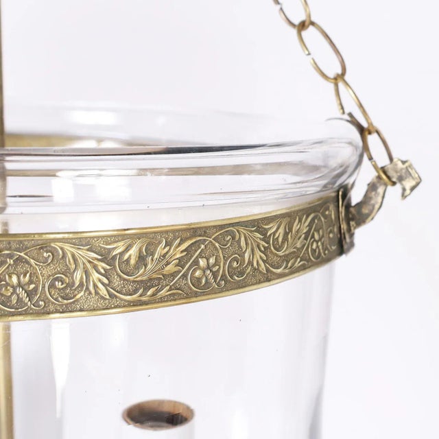 Antique smoke bell light fixture or lantern crafted in hand blown glass in classic form and having brass hardware. Signed...