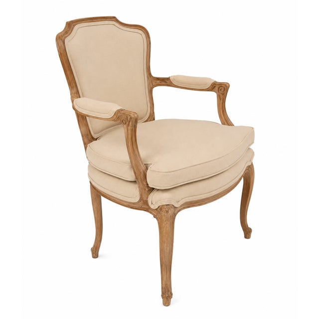 Vintage french accent chair featuring a carved oak wood frame and beige velvet upholstery. Dimensions: 23.5" W x 29.8" D x...