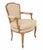 Vintage french accent chair featuring a carved oak wood frame and beige velvet upholstery. Dimensions: 23.5" W x 29.8" D x...