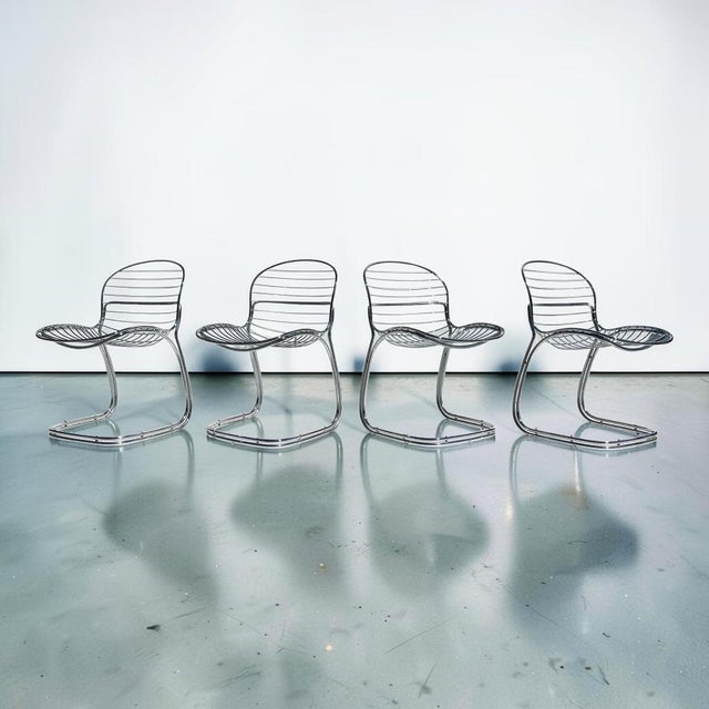 Italian mid-century chrome Sabrina chairs by Gastone Rinaldi for Rima, 1970s. Set of 4 chairs in curved chrome. The seat...