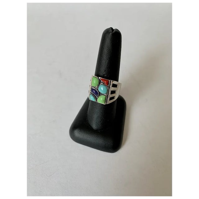 This amazing sterling silver and gem set ring is bezel-set with multicolor dyed howlite. The ring features six stones in...