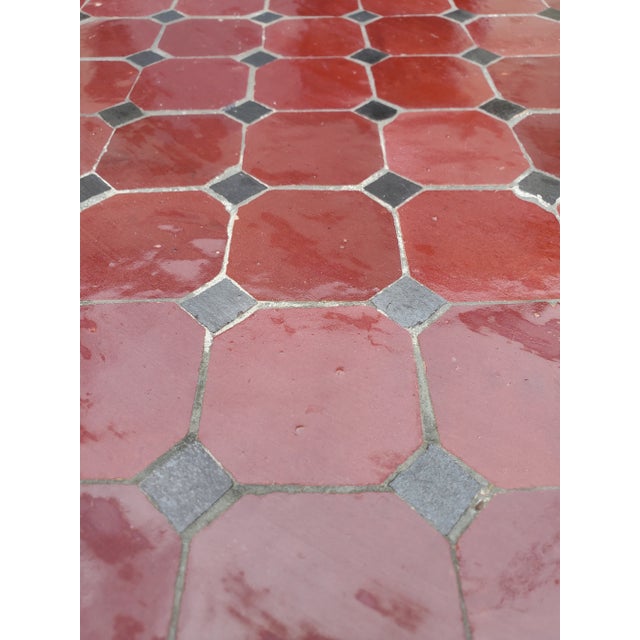 A new arrival. 100 % glazed rectangular. Red and black Moroccan mosaic dining table measuring approximately 28" in width...