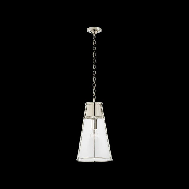 Inspired by modernizing retro styles, Thomas O'Brien designed the Robinson as a refined update of a 1960s lamp. Elegantly...