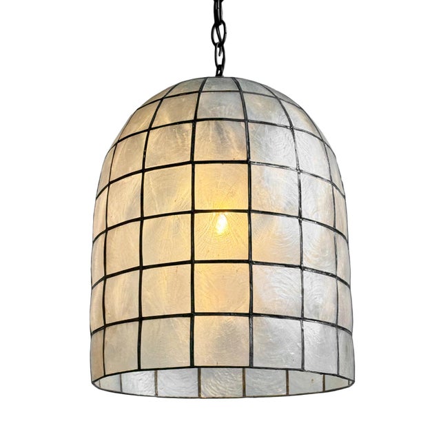 Striking bell shaped lantern made from delicate capiz shell square pattern bonded together with pewter finish metal. Each...