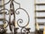 A French vintage steel chandelier from the mid 20th century, with 12 lights, C-scrolls, S-scrolls and dark patina. Created...