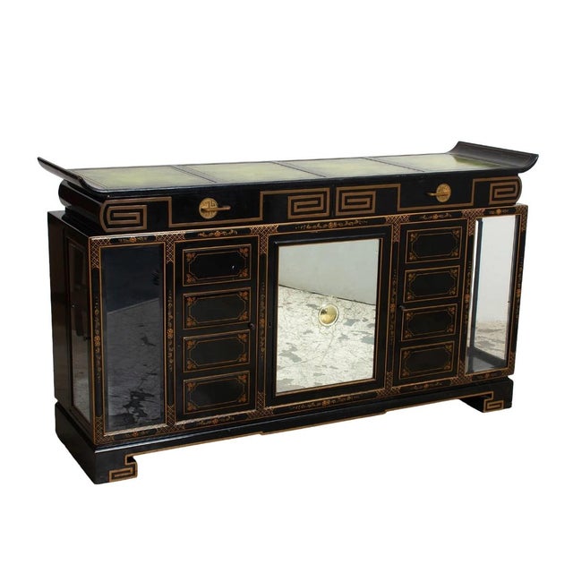 Mid-20th century modern chinoiserie black lacquered sideboard or server, finely crafted with a sleek, architectural...