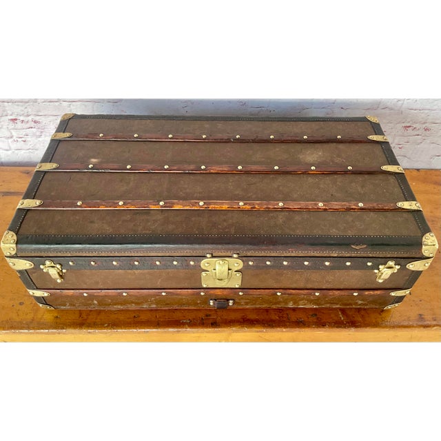 Vintage French Louis Vuitton Cabin Steamer Trunk. Trunk was hand-crafted in the famed Asnieres-sur-Seine workshop. It...
