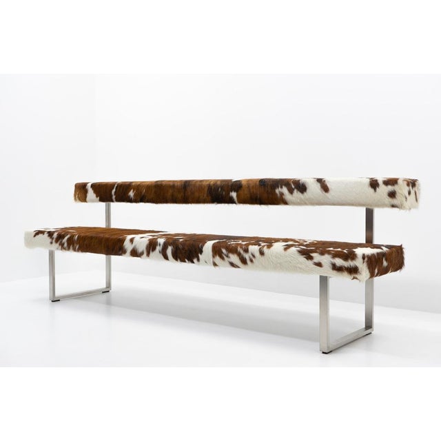 Custom reupholstery by Girsberger, makes this a unique object. Only two benches like this exist. This piece has an...