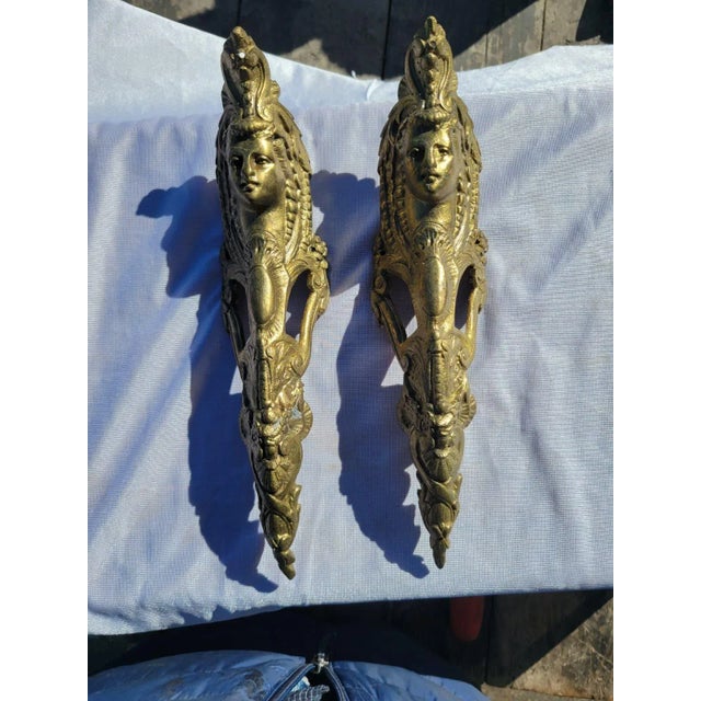 A stunning pair of 19th Century French ormolu bronze mounts featuring finely cast female faces surrounded by intricate...