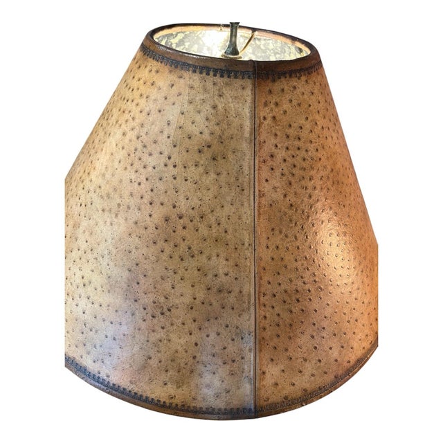 The Paul Maitland-Smith table lamp featuring a faux ostrich shade distinctive piece seamlessly blends high-quality organic...