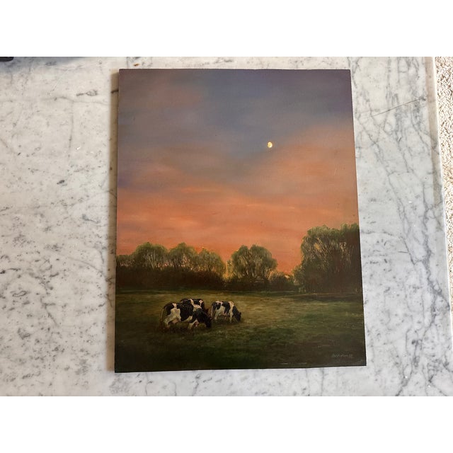 Atmospheric contemporary oil painting depicting two grazing cows in an open meadow at dusk. The composition is dominated...
