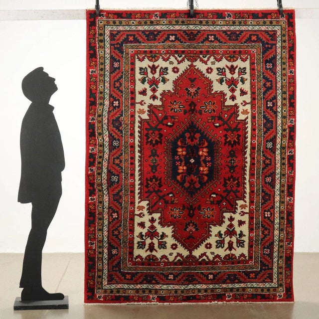 Joshagan rug in cotton and wool; large knot, hand-made. This piece is attributed to the mentioned designer/maker. It has...