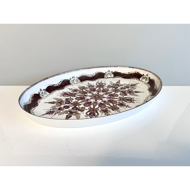 This decorative enamel tray by the Austrian brand ARTA, active between the 1950s and early 1970s, features a rich,...