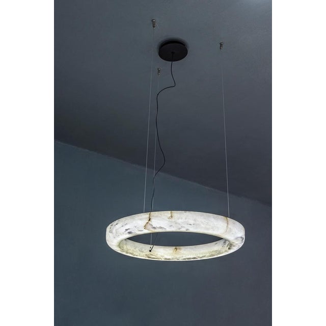 Ring 100 pendant lamp by united alabaster dimensions: d 100 x h 200 cm materials: alabaster all our lamps can be wired...